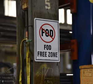 Sign in Sullivan Steel's warehouse denoting a FOD-free zone