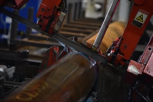 Sullivan Steel's red HFA saw cutting through a 52100 steel tube