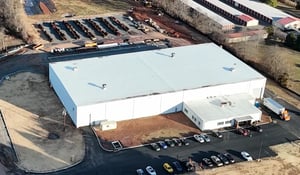 Overhead view of a large, white industrial warehouse